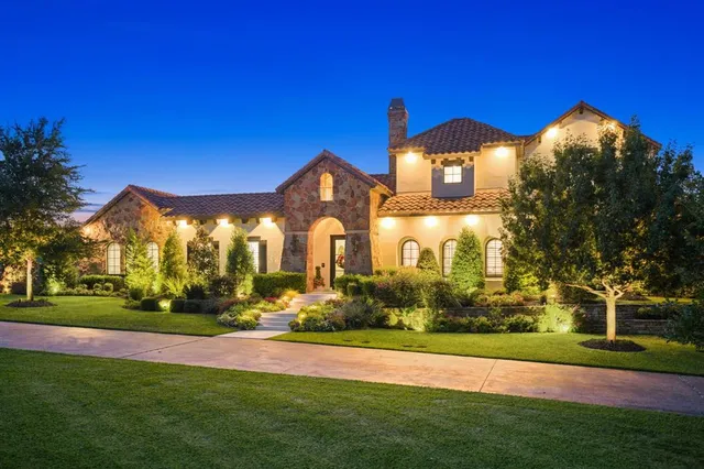 an aerial view of residential houses with outdoor space and street view
