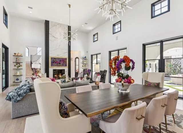 a view of a dining room with furniture and a large window