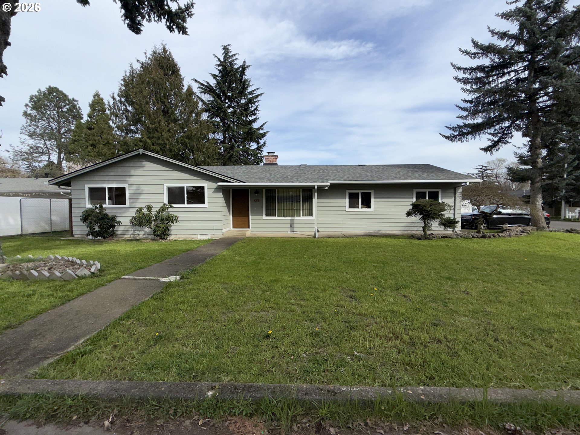 5270 Southwest 182nd Avenue Beaverton, OR 97078 - Photo 1 of 35 a front view of a house with a yard