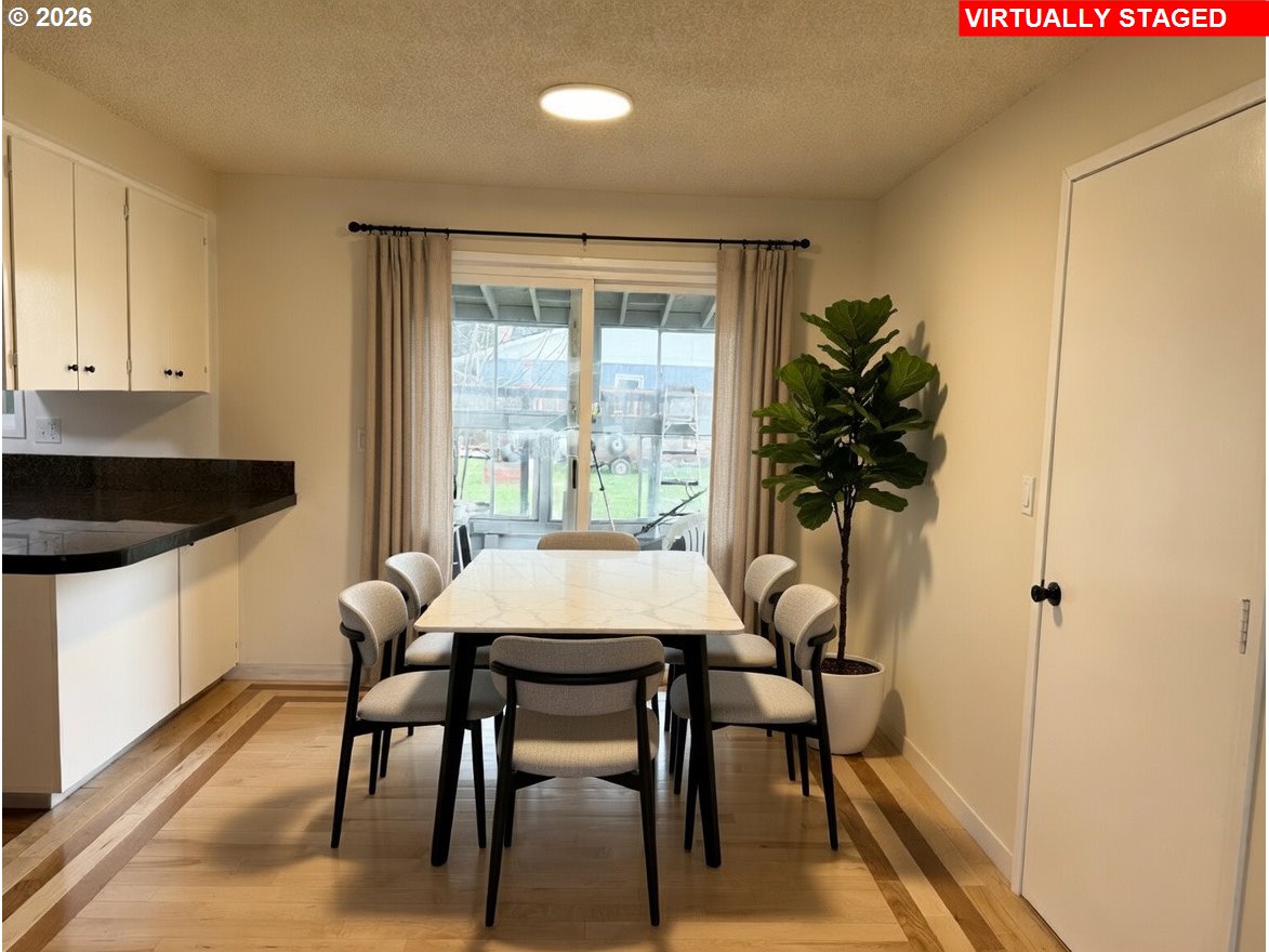 5270 Southwest 182nd Avenue Beaverton, OR 97078 - Photo 15 of 35 a view of a dining room with furniture and a potted plant