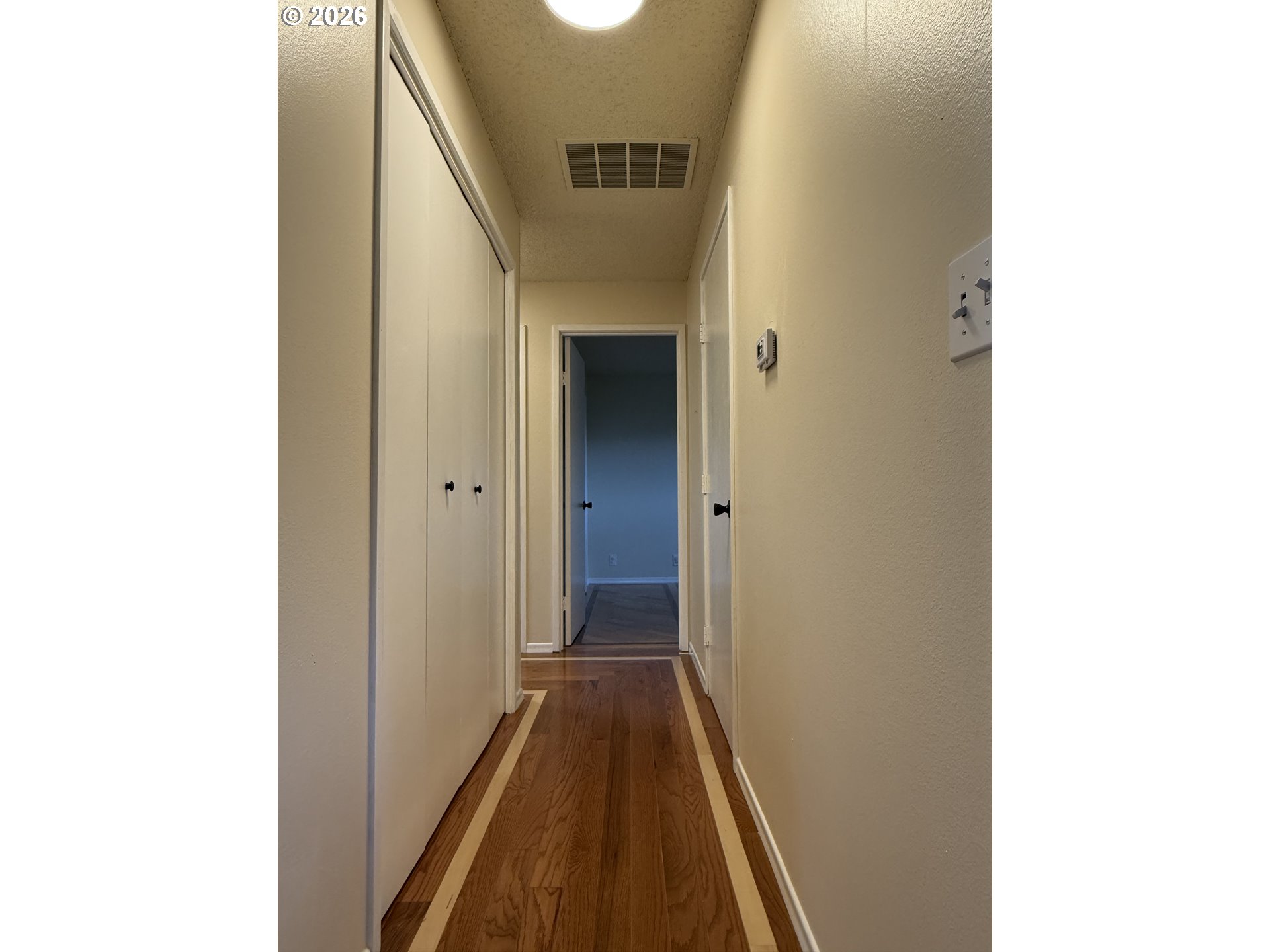 5270 Southwest 182nd Avenue Beaverton, OR 97078 - Photo 16 of 35 a view of a hallway with wooden floor
