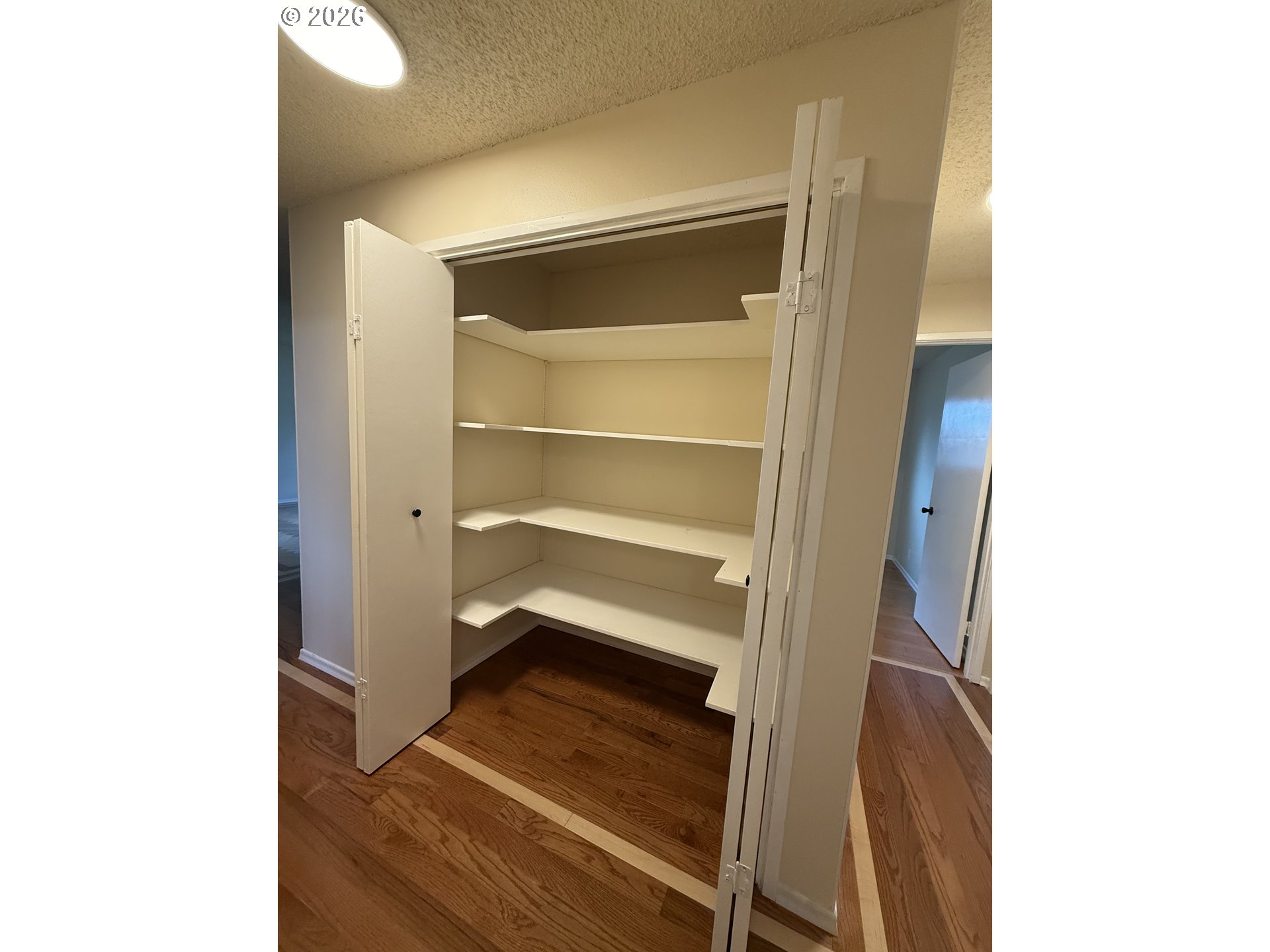 5270 Southwest 182nd Avenue Beaverton, OR 97078 - Photo 17 of 35 a view of walk in closet with empty racks