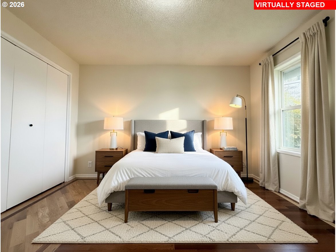 5270 Southwest 182nd Avenue Beaverton, OR 97078 - Photo 20 of 35 a bedroom with a bed lamp and a large window