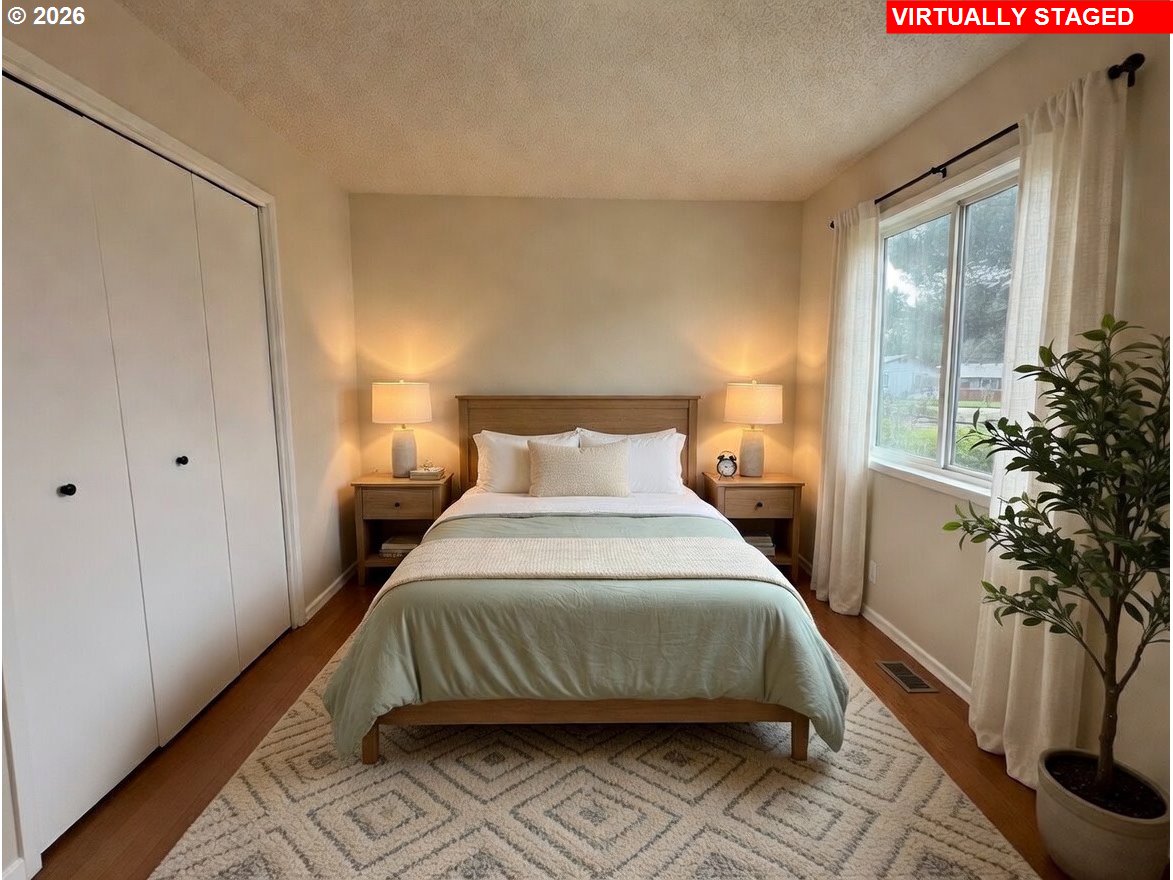 5270 Southwest 182nd Avenue Beaverton, OR 97078 - Photo 24 of 35 a bedroom with a bed and a potted plant
