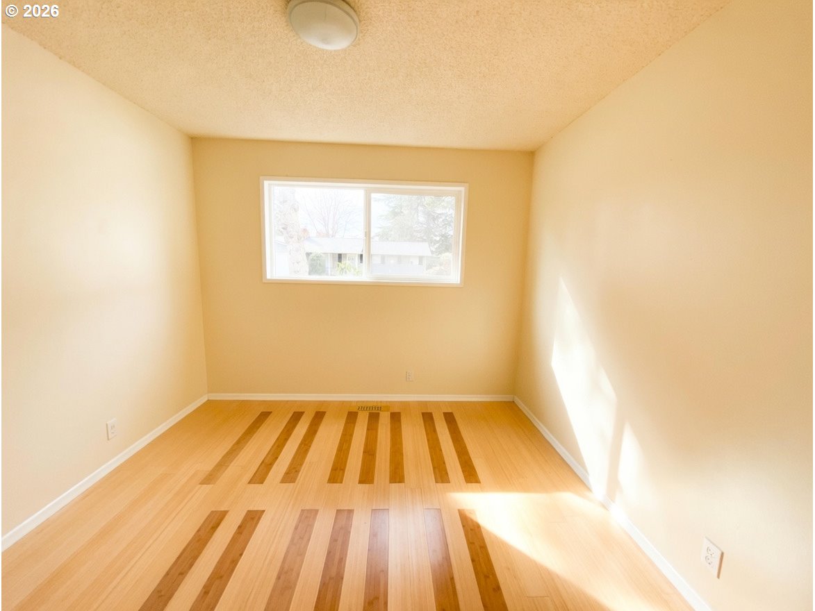 5270 Southwest 182nd Avenue Beaverton, OR 97078 - Photo 27 of 35 a view of a room with wooden floor and a window