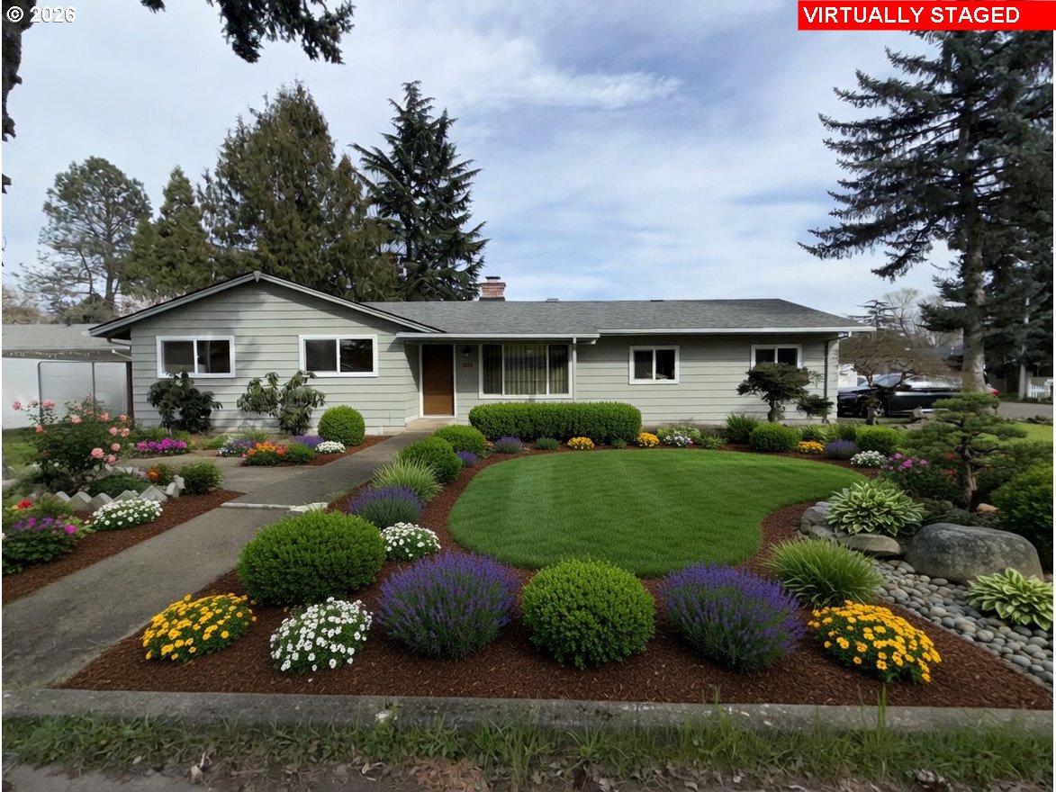 5270 Southwest 182nd Avenue Beaverton, OR 97078 - Photo 3 of 35 a front view of a house with a yard and outdoor seating