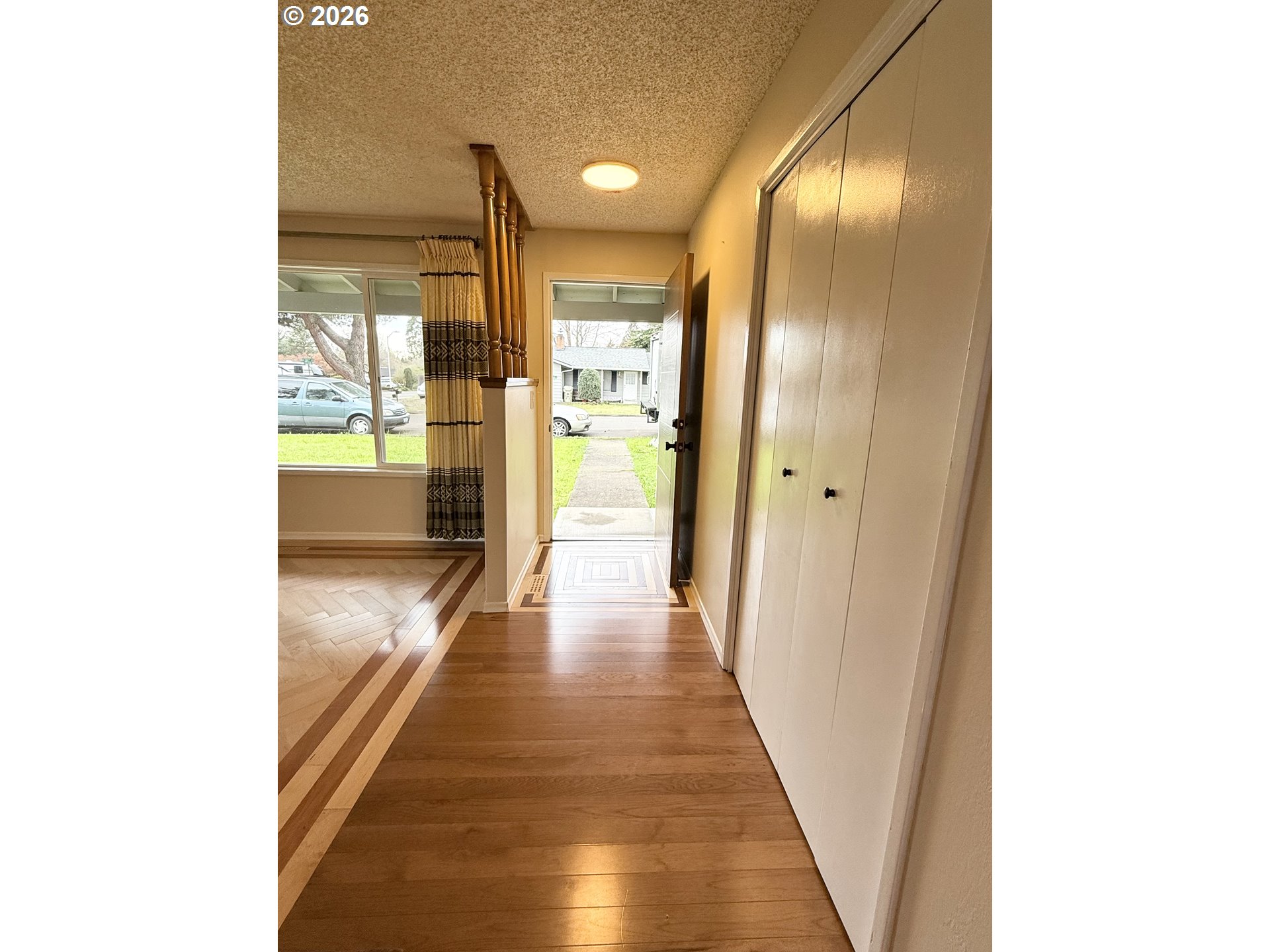 5270 Southwest 182nd Avenue Beaverton, OR 97078 - Photo 6 of 35 a view of a hallway with wooden floor