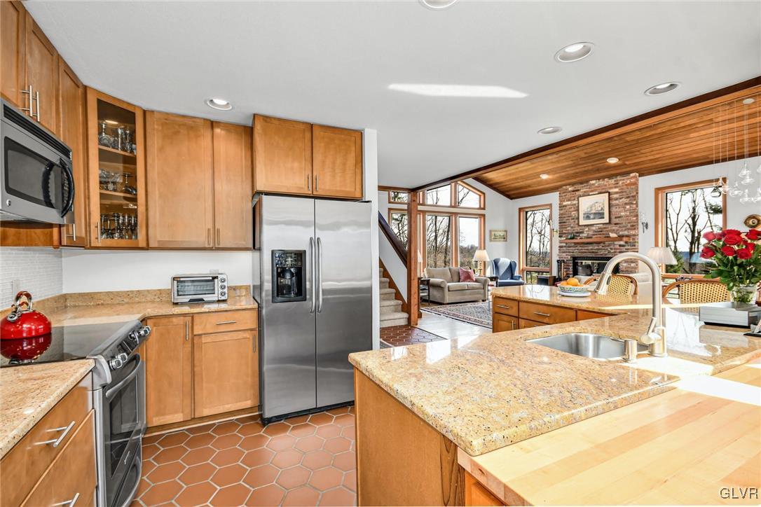290 Steely Hill Road Riegelsville, PA 18077 - Photo 12 of 33 a kitchen with stainless steel appliances granite countertop a sink stove and refrigerator