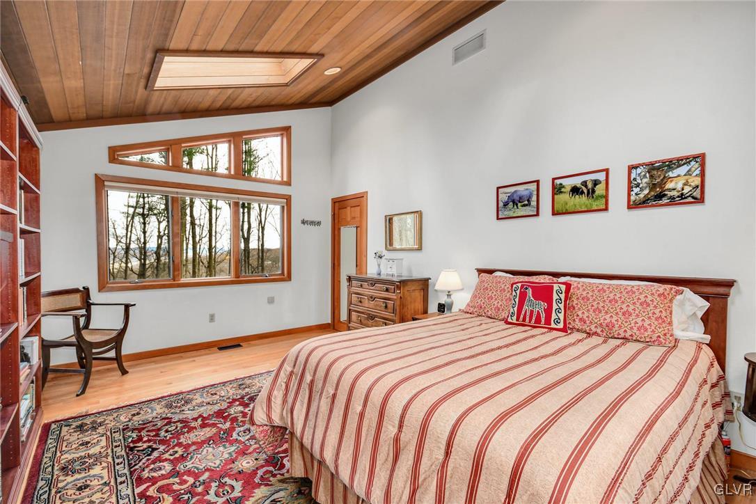 290 Steely Hill Road Riegelsville, PA 18077 - Photo 14 of 33 a bedroom with a bed and a window