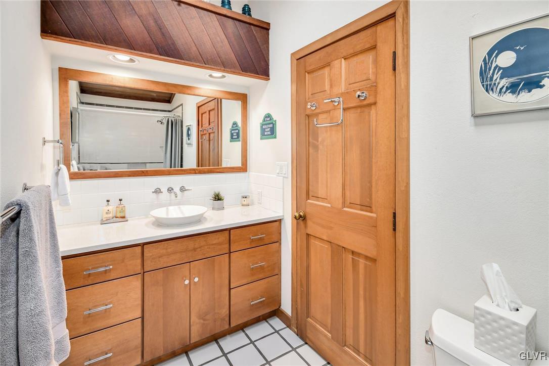 290 Steely Hill Road Riegelsville, PA 18077 - Photo 18 of 33 a bathroom with a granite countertop sink mirror and a toilet