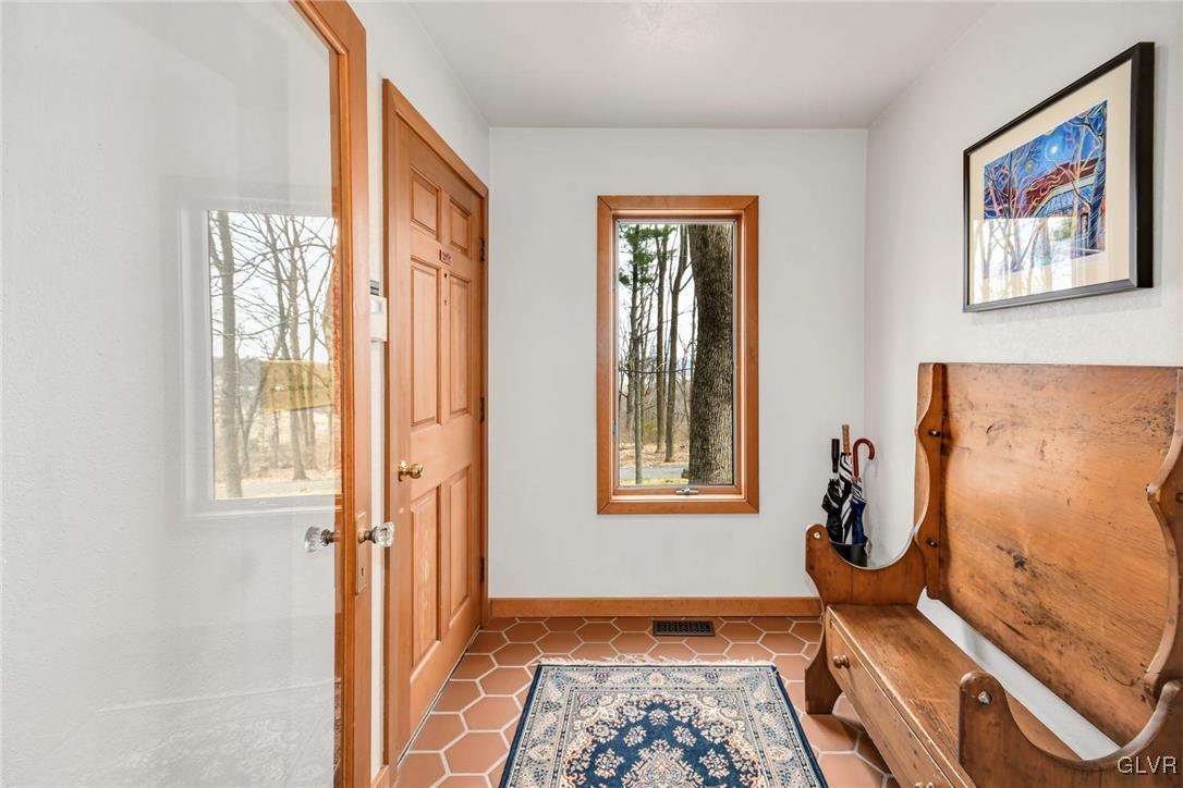 290 Steely Hill Road Riegelsville, PA 18077 - Photo 3 of 33 a view of an entryway with furniture and wooden floor
