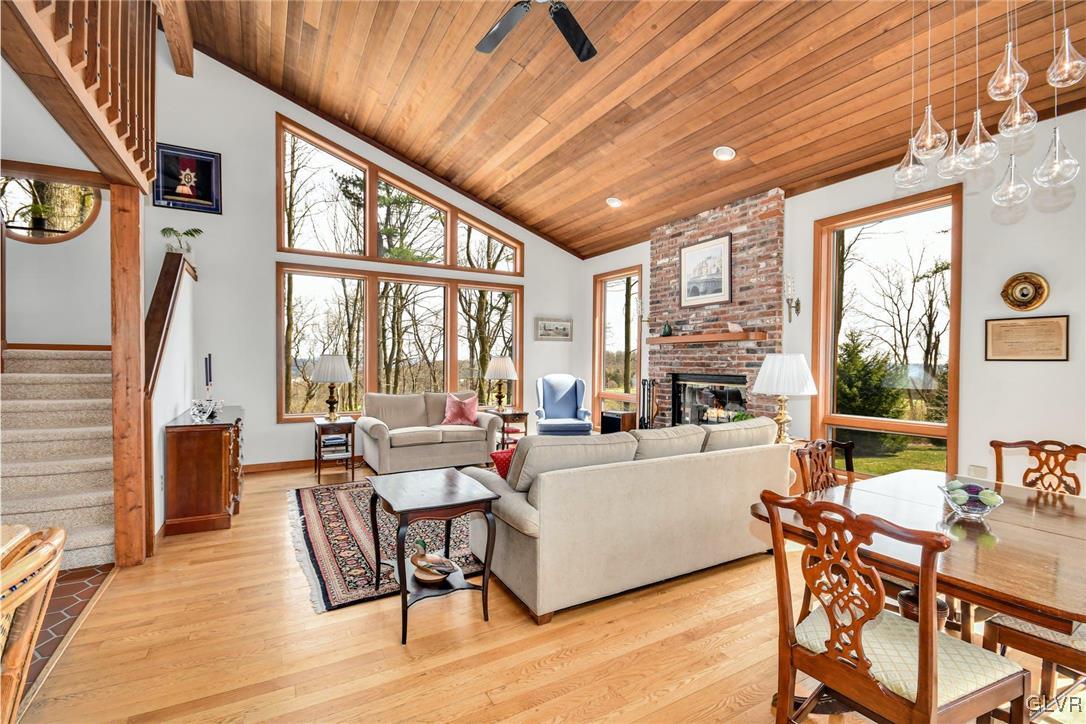 290 Steely Hill Road Riegelsville, PA 18077 - Photo 5 of 33 a living room with fireplace furniture and a large window