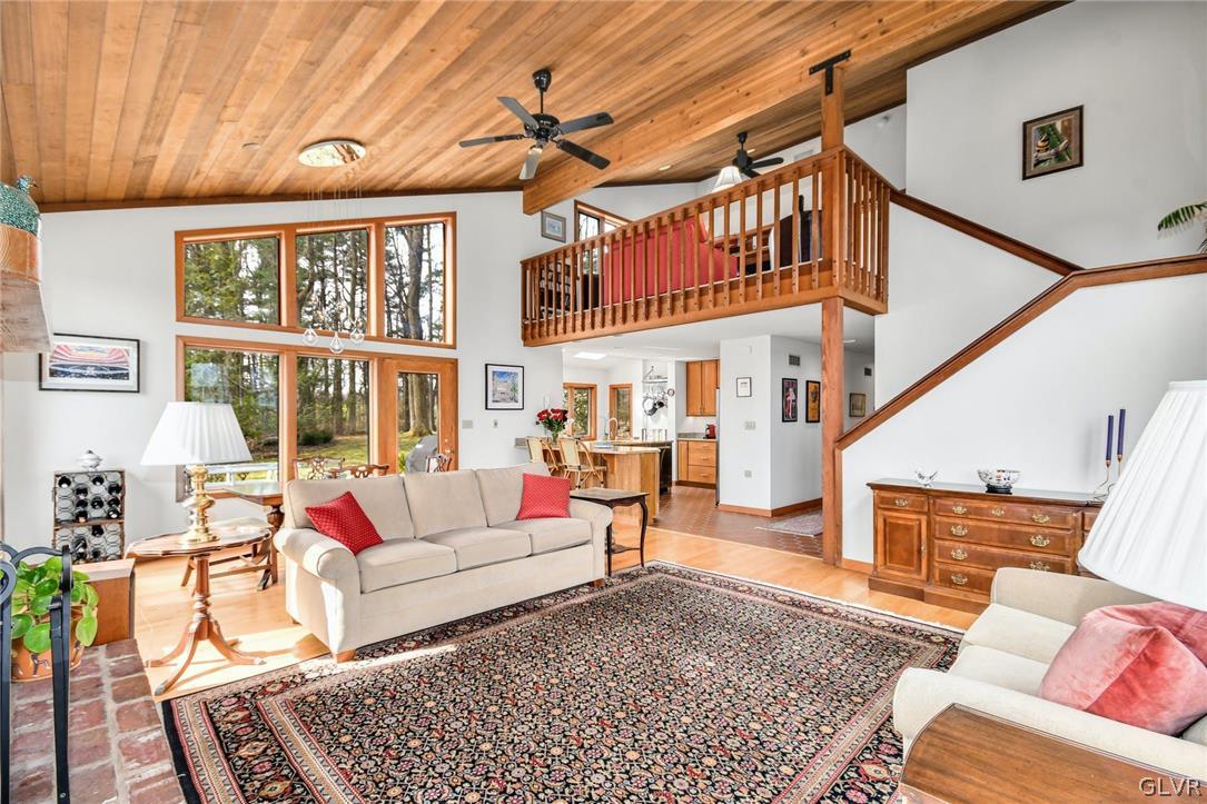 290 Steely Hill Road Riegelsville, PA 18077 - Photo 6 of 33 a living room with furniture a rug and a window