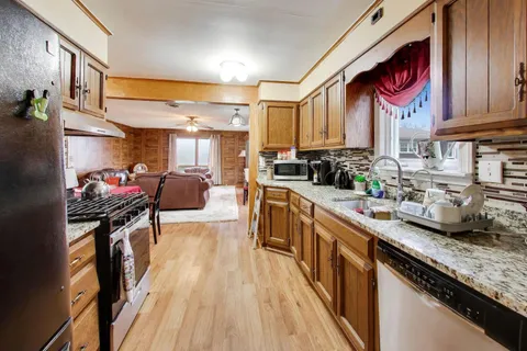 a bed room with a bed and a chandelier
