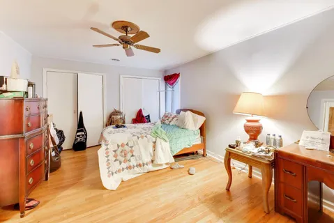 a bed room with a bed and a chandelier