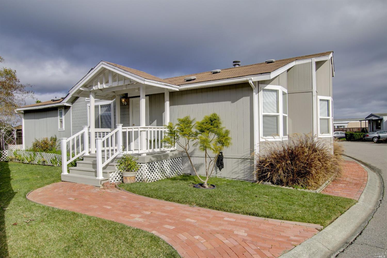 297 Yosemite Road, Unit 297 San Rafael, CA 94903 - Photo 1 of 1 a front view of a house with garden