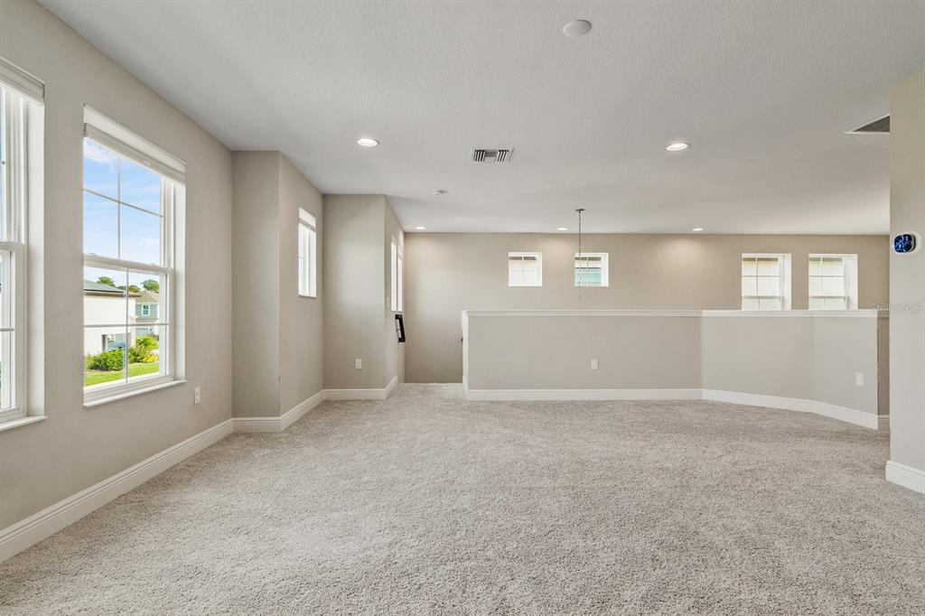 17880 Moon Rise Pass Land O Lakes, FL 34638 - Photo 21 of 43 an empty room with windows and closet