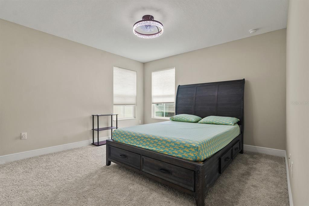 17880 Moon Rise Pass Land O Lakes, FL 34638 - Photo 23 of 43 a bedroom with a bed and a window