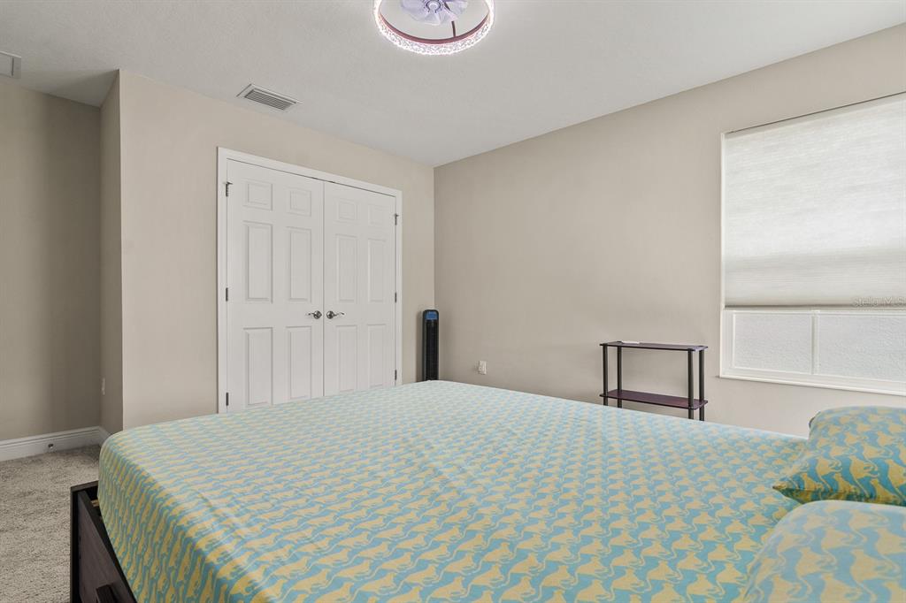 17880 Moon Rise Pass Land O Lakes, FL 34638 - Photo 24 of 43 a bedroom with a bed and a window