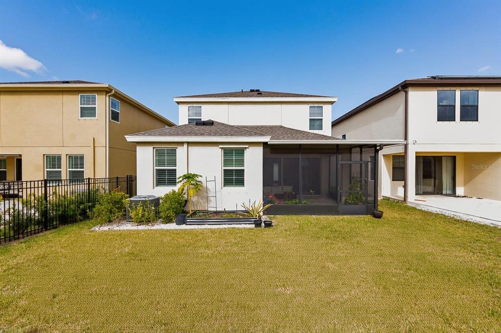 17880 Moon Rise Pass Land O Lakes, FL 34638 - Photo 34 of 43 a front view of house with yard and green space