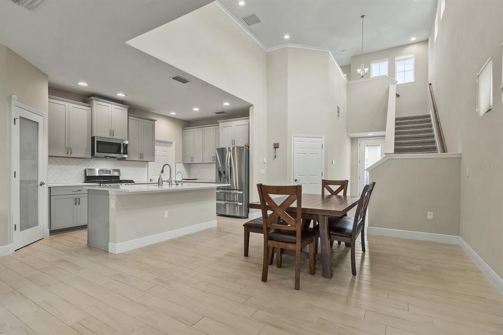 17880 Moon Rise Pass Land O Lakes, FL 34638 - Photo 6 of 43 a kitchen with a table and chairs in it