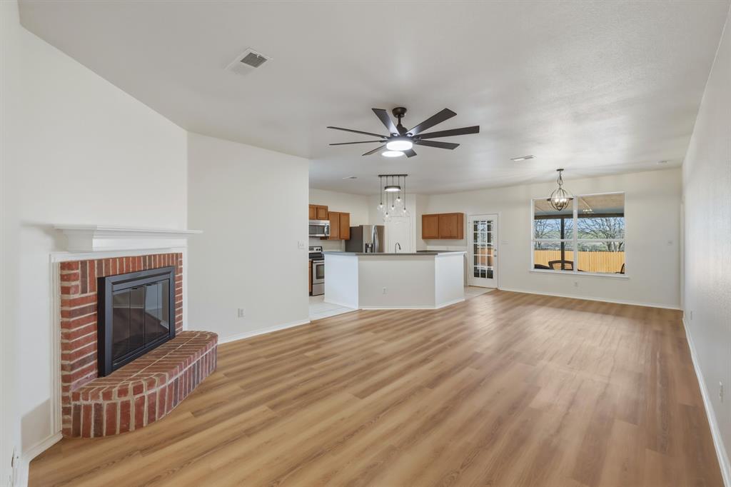 13509 Ponderosa Ranch Road Fort Worth, TX 76262 - Photo 12 of 33 New laminate flooring.