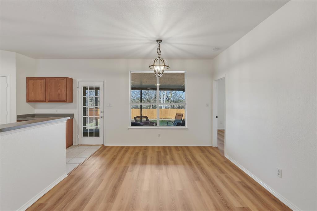 13509 Ponderosa Ranch Road Fort Worth, TX 76262 - Photo 20 of 33 Dining room with great backyard views.