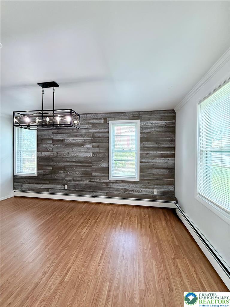 5540 Main Street Whitehall, PA 18052 - Photo 12 of 53 Natural light streams into this versatile room, highlighted by a contemporary light fixture.