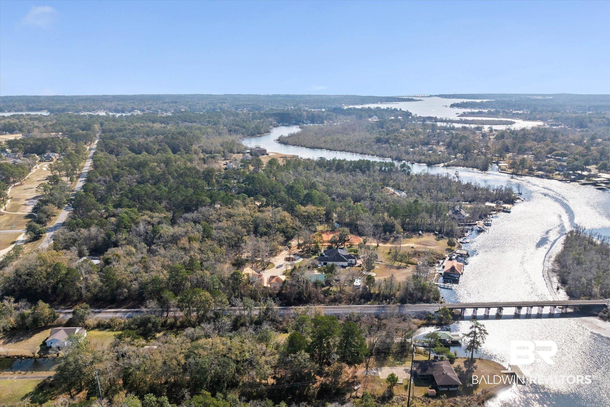 3847 Riviere Du Chien Road Mobile, AL 36693 - Photo 44 of 51 Aerial view of property and surrounding area with a large body of water and a forest