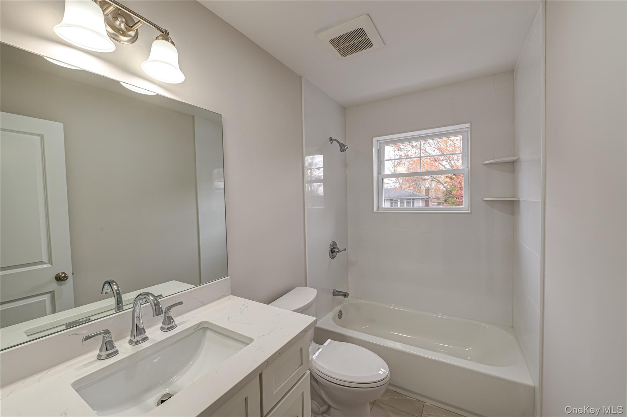 370 Canal Road Port Jefferson Station, NY 11776 - Photo 14 of 16 a bathroom with a sink toilet and shower