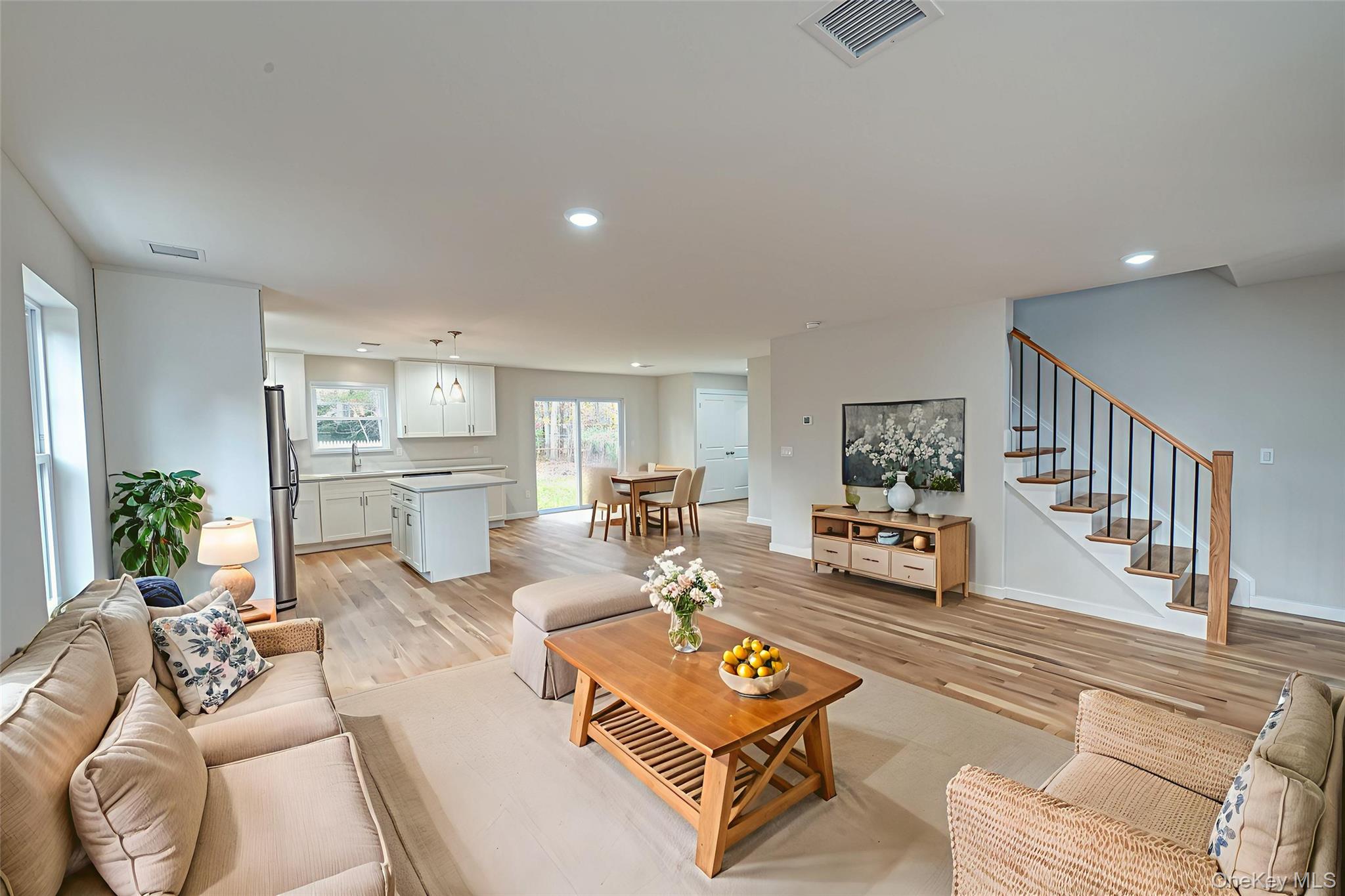 370 Canal Road Port Jefferson Station, NY 11776 - Photo 4 of 16 a living room with furniture and a table