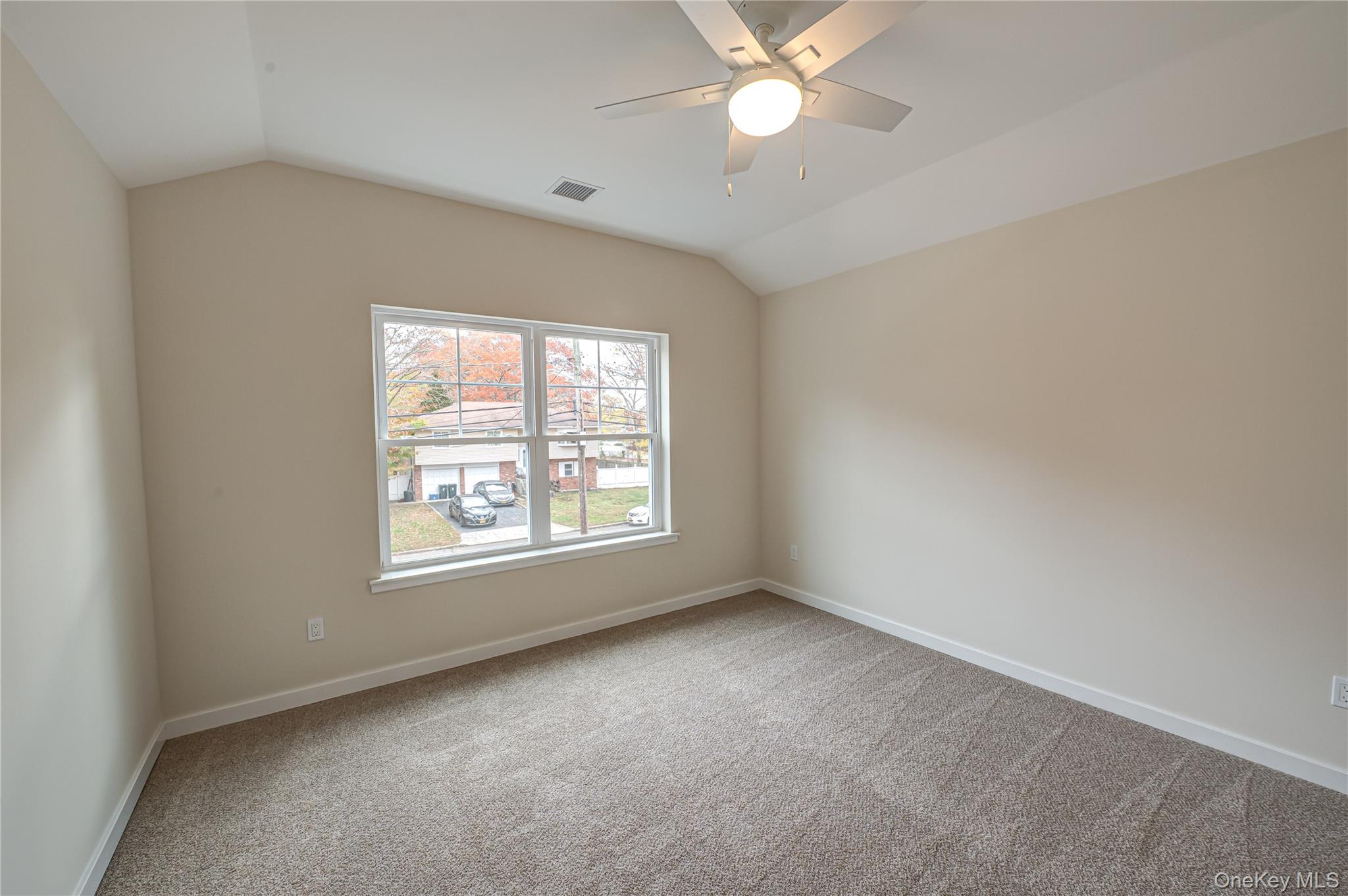 370 Canal Road Port Jefferson Station, NY 11776 - Photo 9 of 16 an empty room with a window and a fan