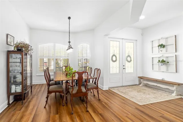 a living room with furniture a fireplace and a large window