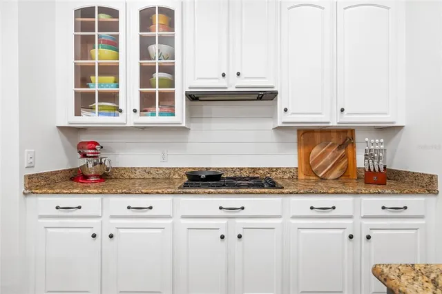 a living room with furniture large window and a flat screen tv