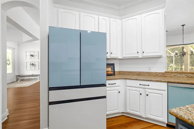 a living room with furniture and next to a window