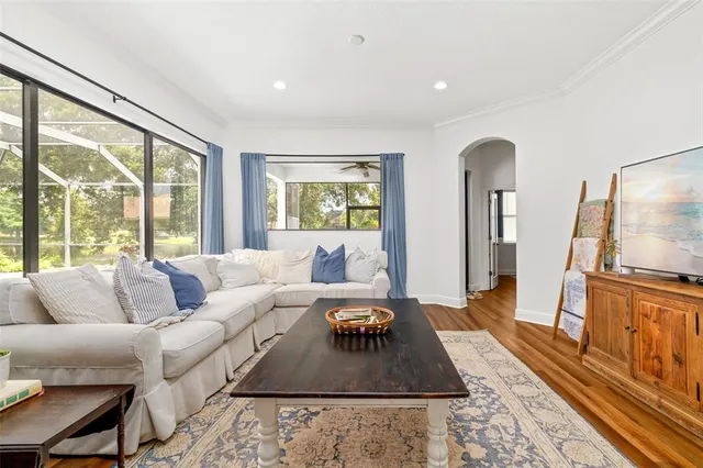a view of a bedroom with bed and window