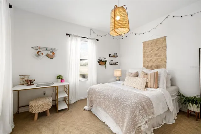 an aerial view of residential houses with outdoor space and lake view