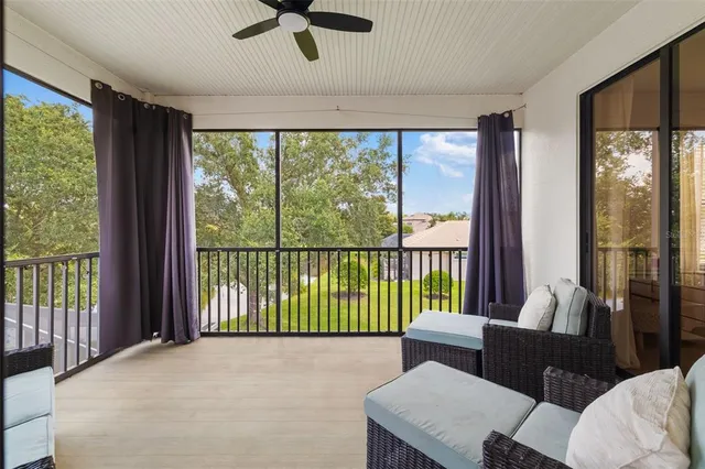 an aerial view of a house with a yard and lake view