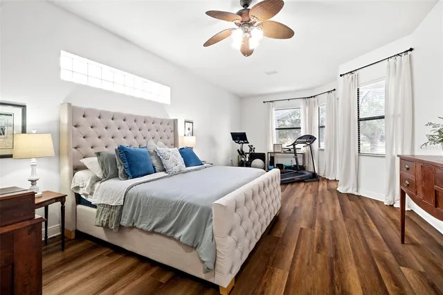 a bed room with a bed and a chandelier