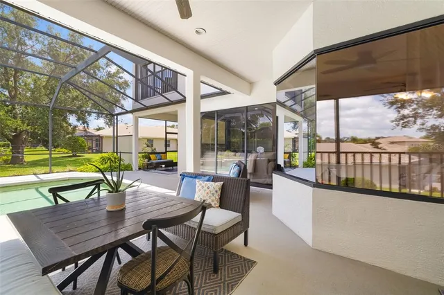 a view of a patio with a table and chairs