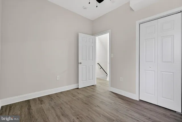 an empty room with wooden floor