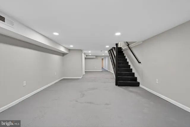 a view of an empty room with stairs