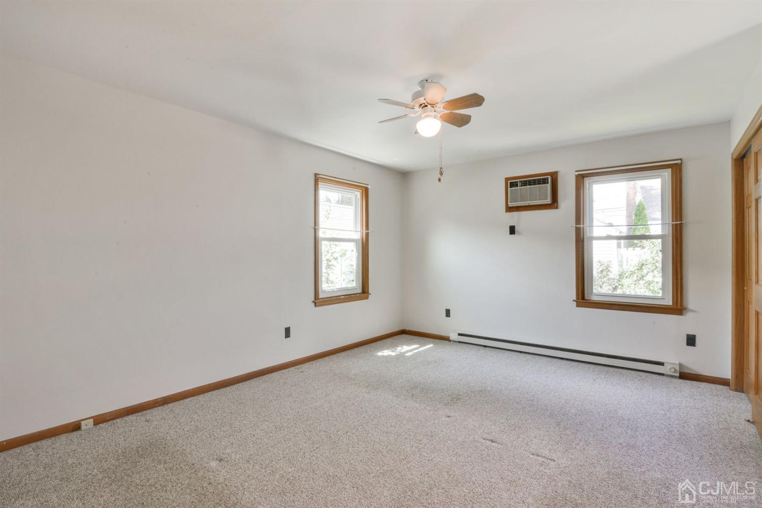 120 Harvard Road Linden, NJ 07036 - Photo 12 of 19 an empty room with windows and fan