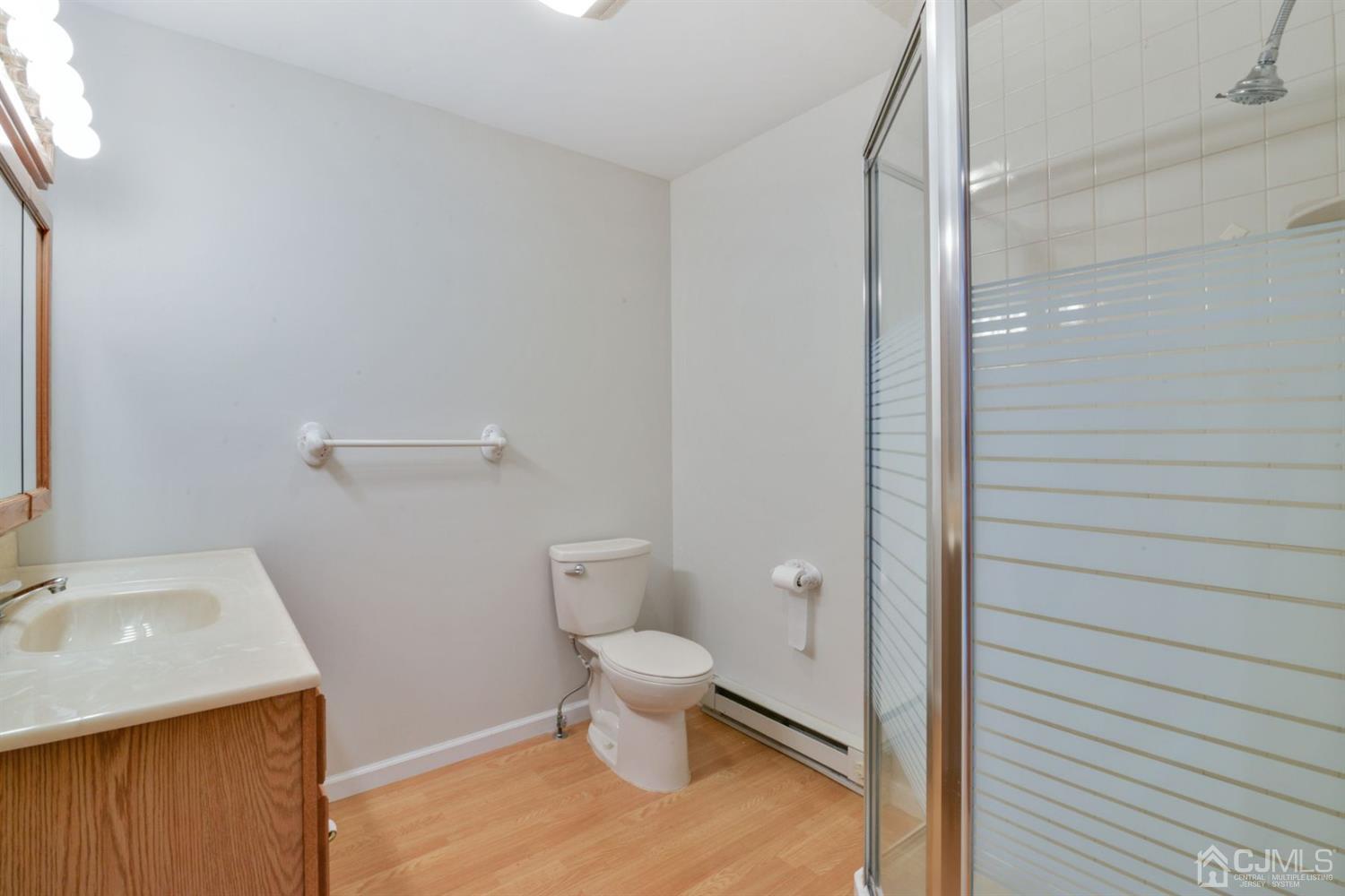 120 Harvard Road Linden, NJ 07036 - Photo 13 of 19 a bathroom with a sink and a vanity