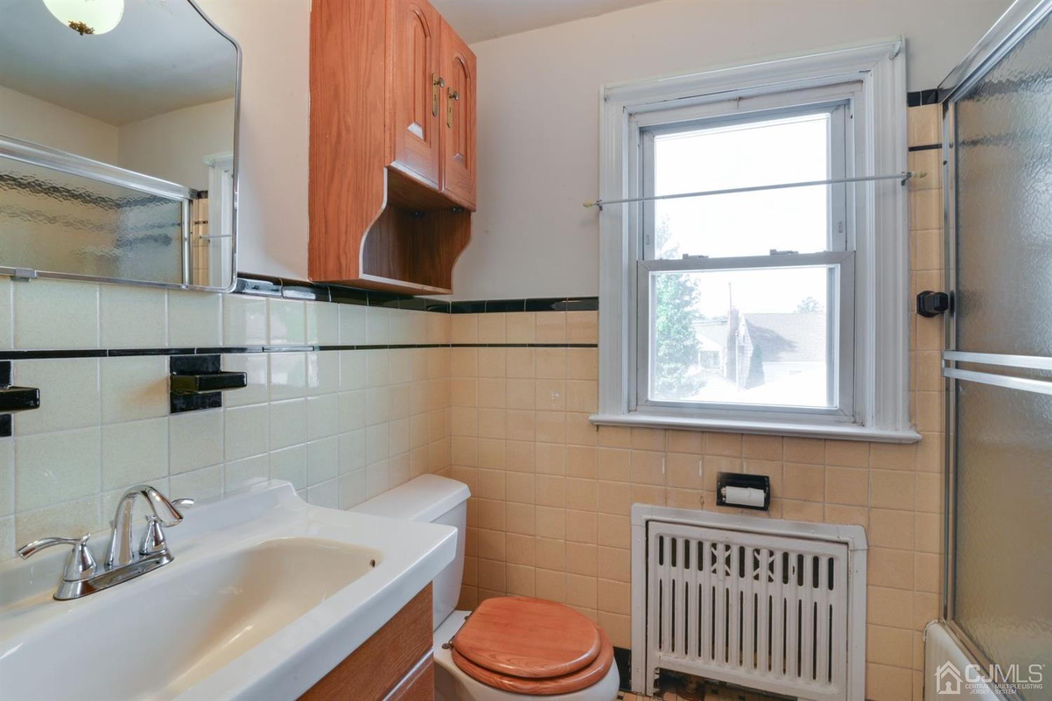 120 Harvard Road Linden, NJ 07036 - Photo 17 of 19 a bathroom with a sink toilet a mirror and shower
