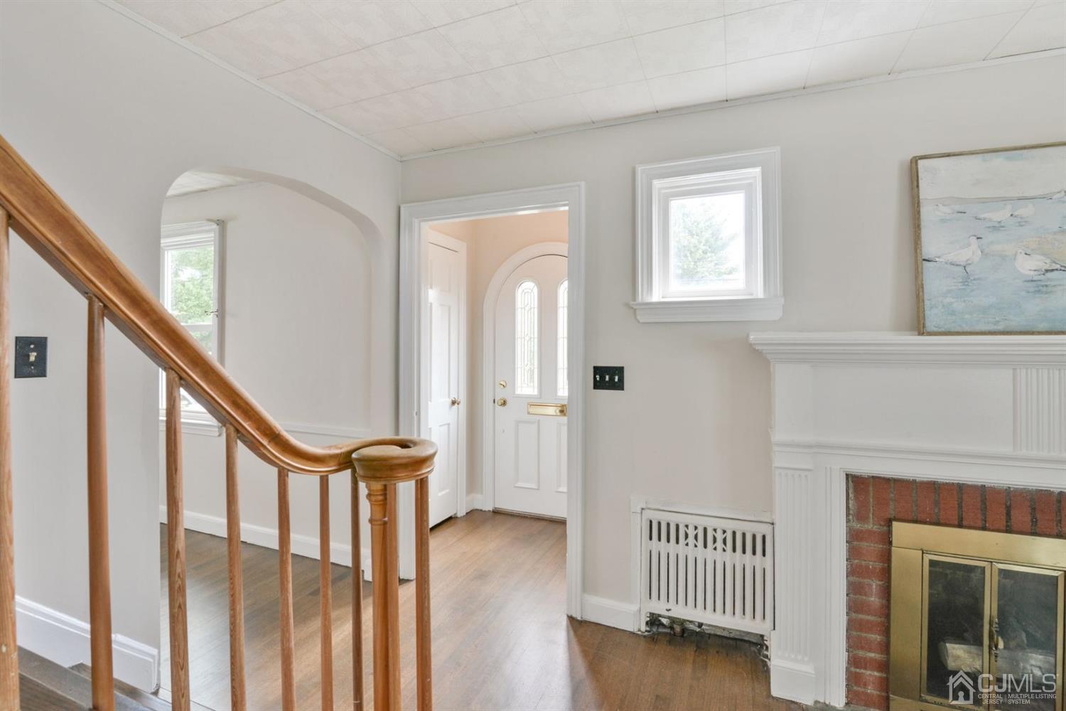 120 Harvard Road Linden, NJ 07036 - Photo 3 of 19 a view of a livingroom with furniture and stairs