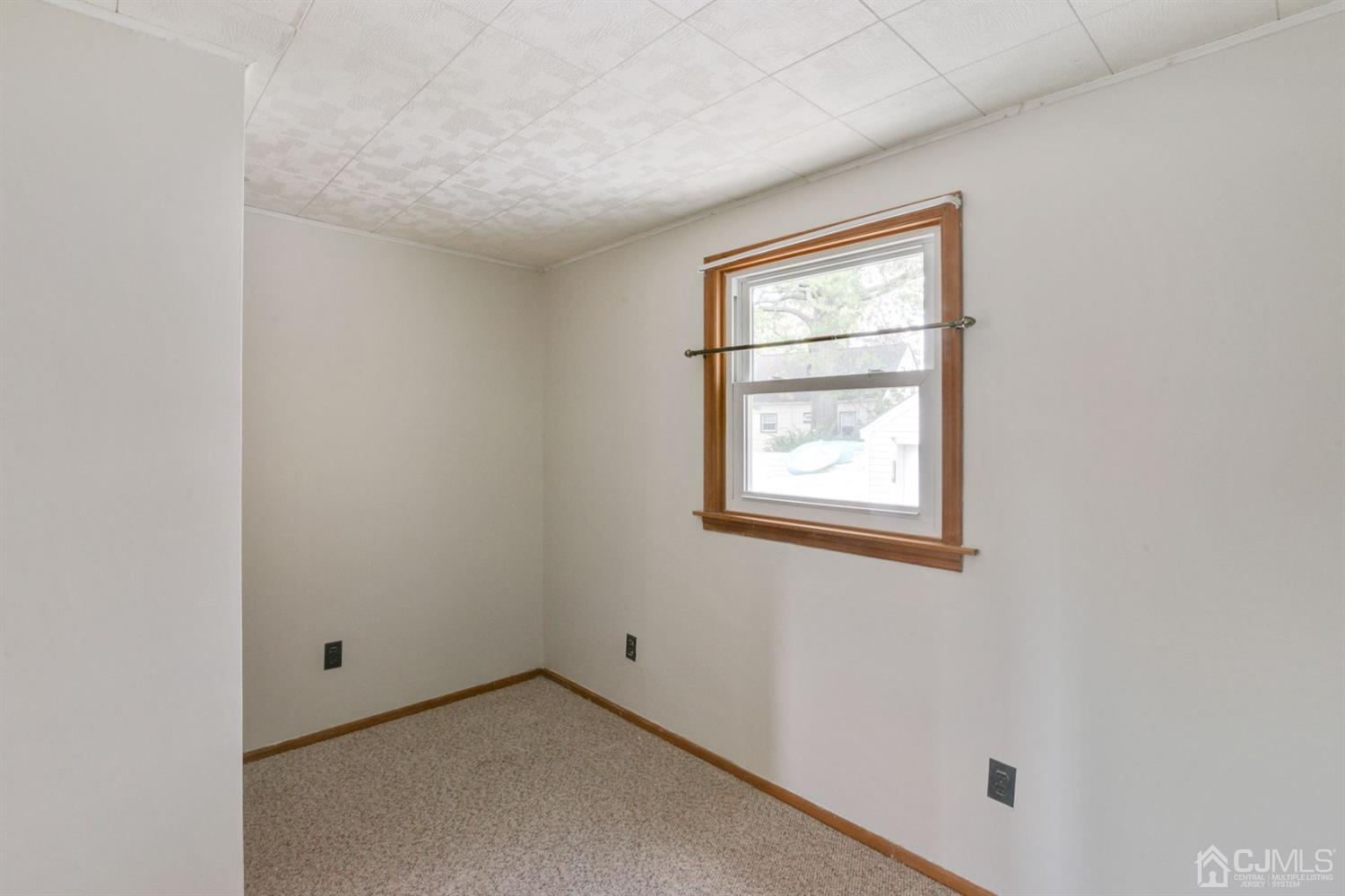 120 Harvard Road Linden, NJ 07036 - Photo 5 of 19 a view of an empty room with window