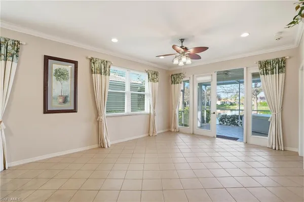 a view of an entryway with wooden floor and a ceiling fan