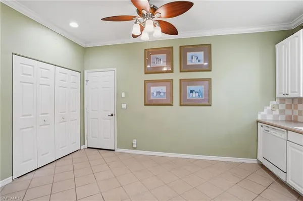 a view of an empty room with a fan