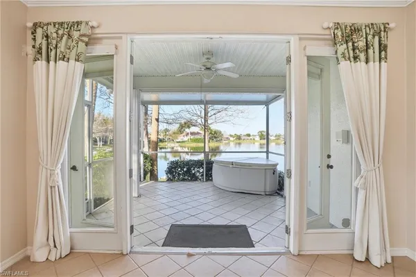 a bathroom with a tub shower and window